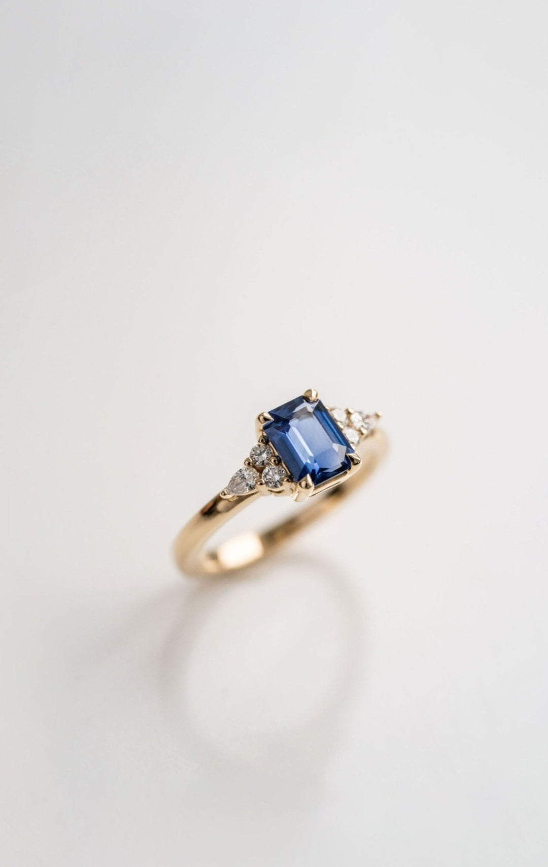 Emerald Cut Blue Sapphire With Diamond Cluster Accents