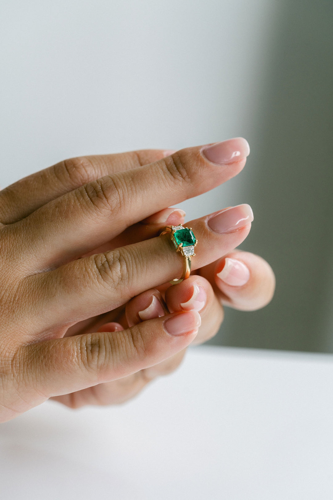 Emerald Cut Emerald With Trapezoid Diamond Accents