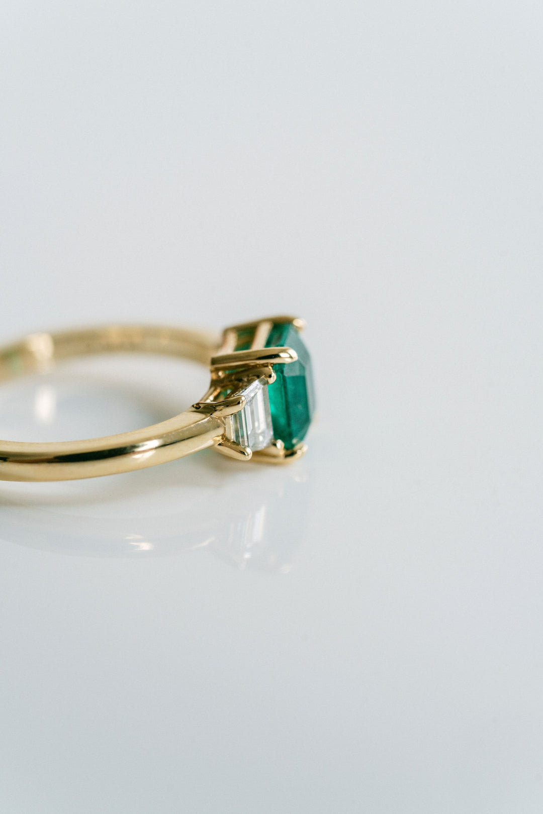 Emerald Cut Emerald With Trapezoid Diamond Accents