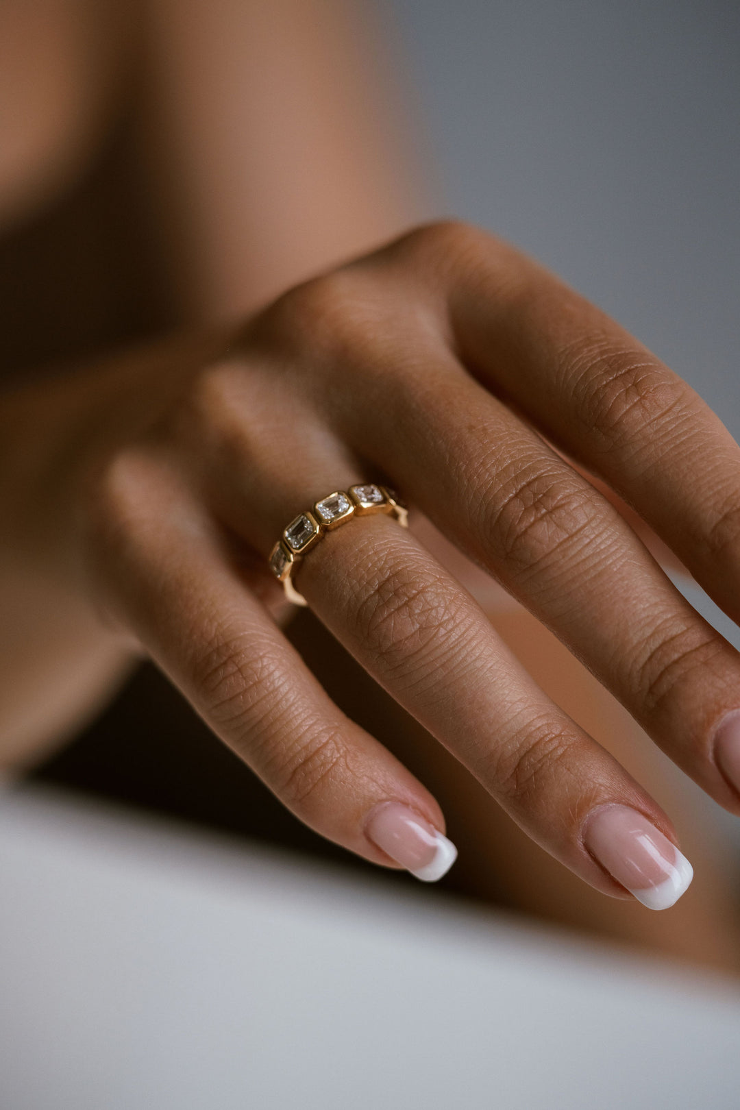 Emerald Cut Diamond East-West Bezel Band