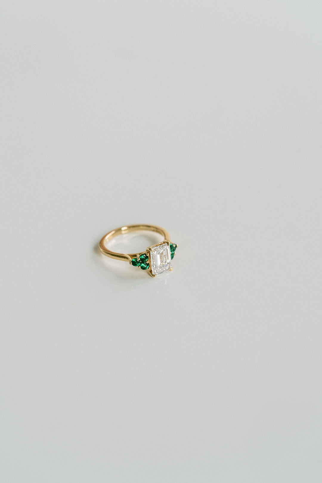 Emerald Cut Diamond With Emerald Cluster Accents