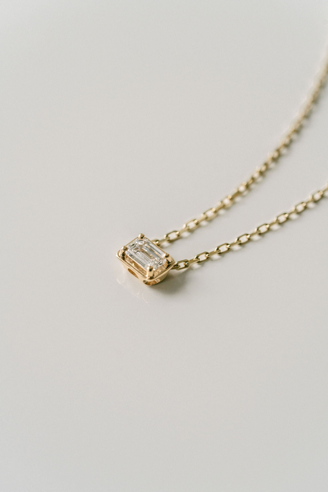 Emerald Cut East-West Framed Diamond Slider Necklace