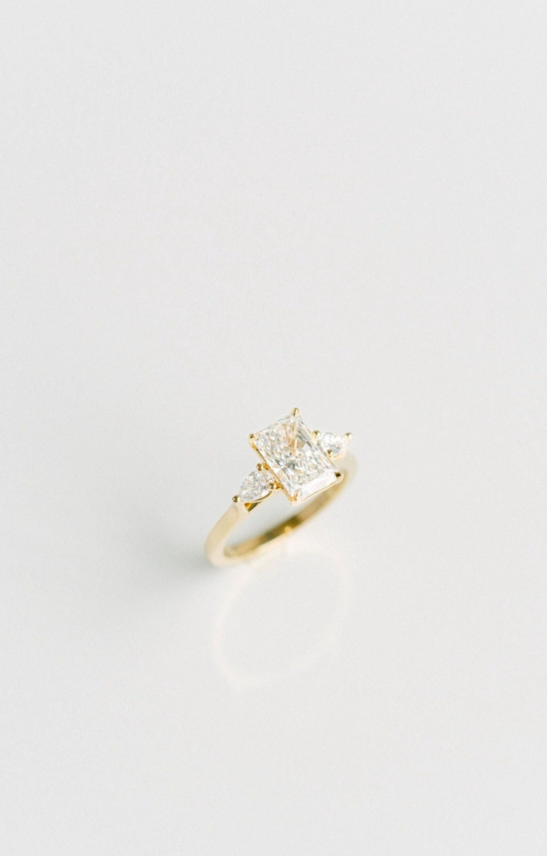 Radiant Cut Diamond Engagement Ring With Pear Shape Accents, 14k Yellow Gold