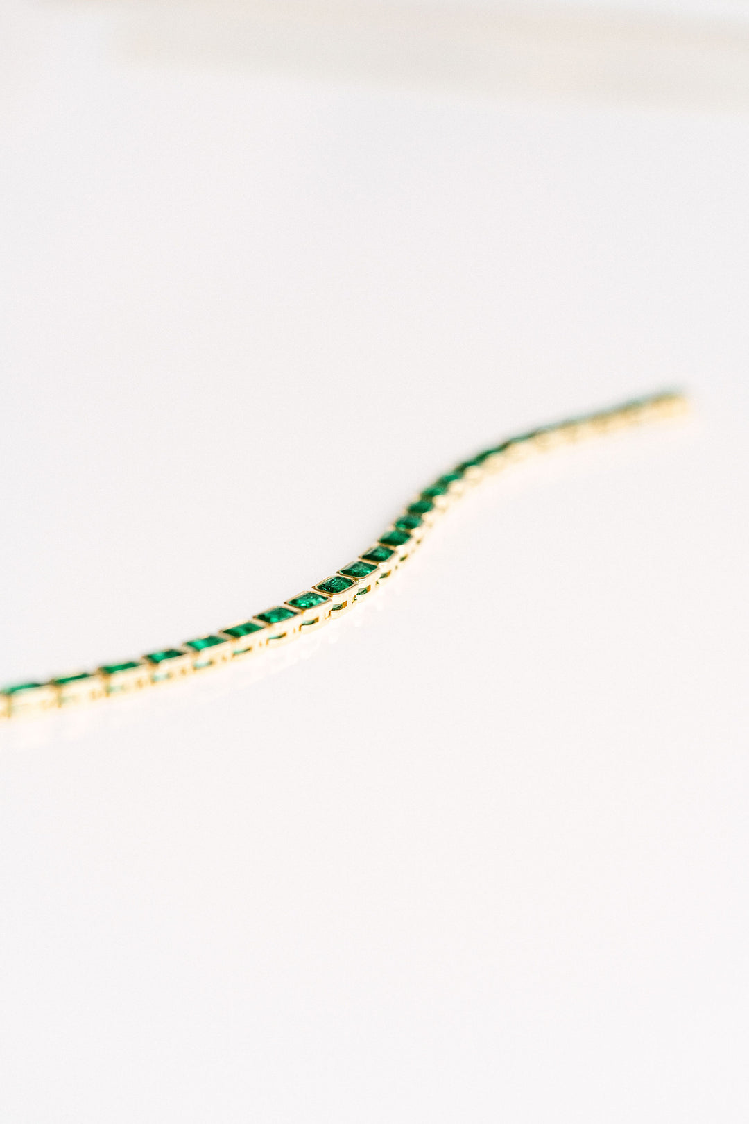7.50ctw Emerald Cut Colombian Emerald Bezel Tennis Bracelet, 14k Yellow Gold