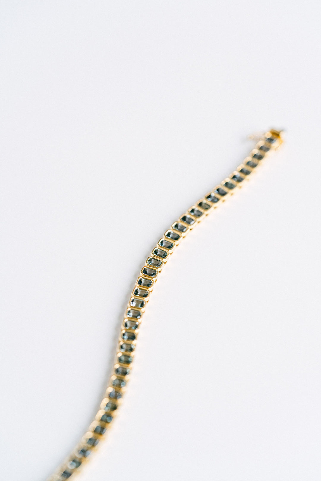 9.21ctw. Emerald Cut Blue-Green Sri Lankan Sapphire Bezel Tennis Bracelet, 14k Yellow Gold