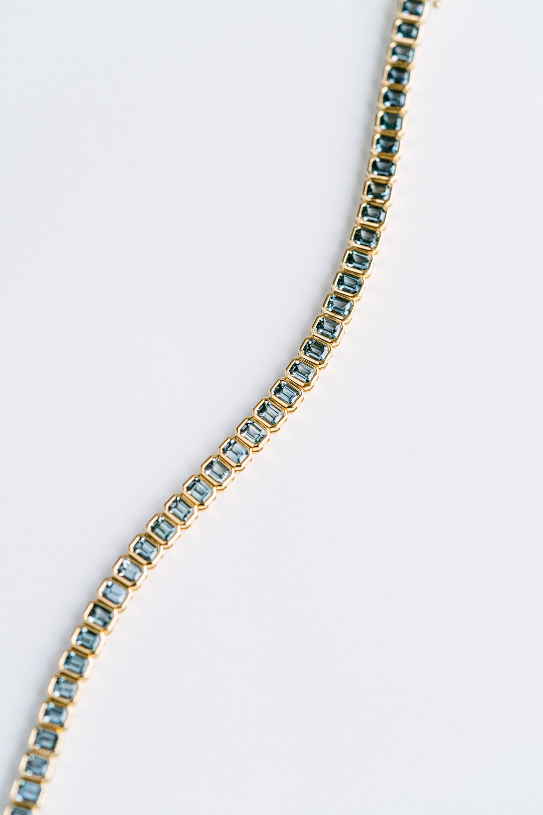 9.21ctw. Emerald Cut Blue-Green Sri Lankan Sapphire Bezel Tennis Bracelet, 14k Yellow Gold