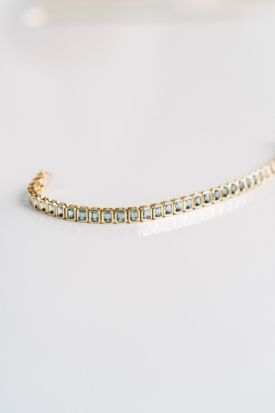 9.21ctw. Emerald Cut Blue-Green Sri Lankan Sapphire Bezel Tennis Bracelet, 14k Yellow Gold