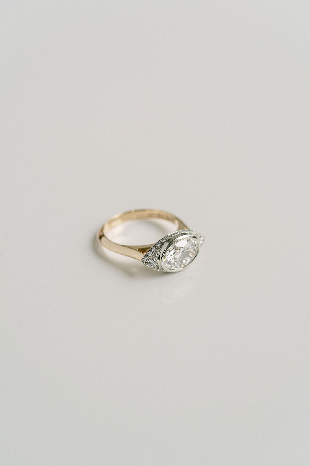Cavalier Fine Jewelry - Oval Diamond Two Tone Ring With Diamond Eye Halo