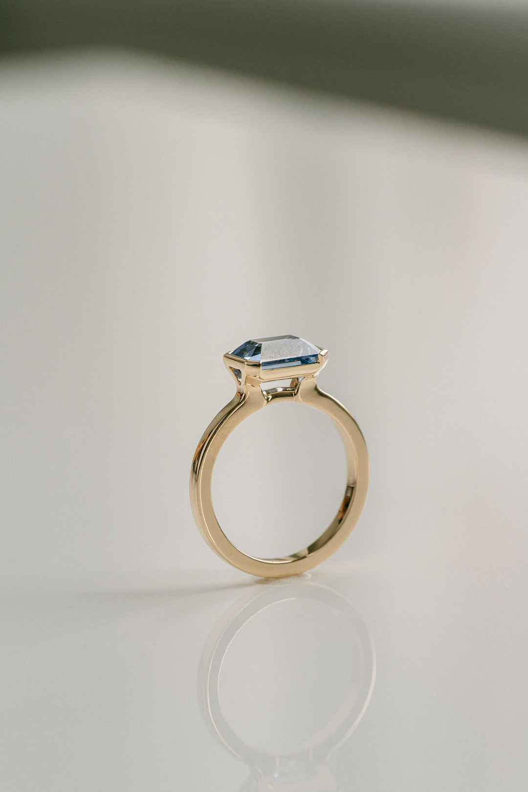 Emerald Cut Blue Sri Lankan Sapphire East-West Half Bezel, 14k Yellow Gold