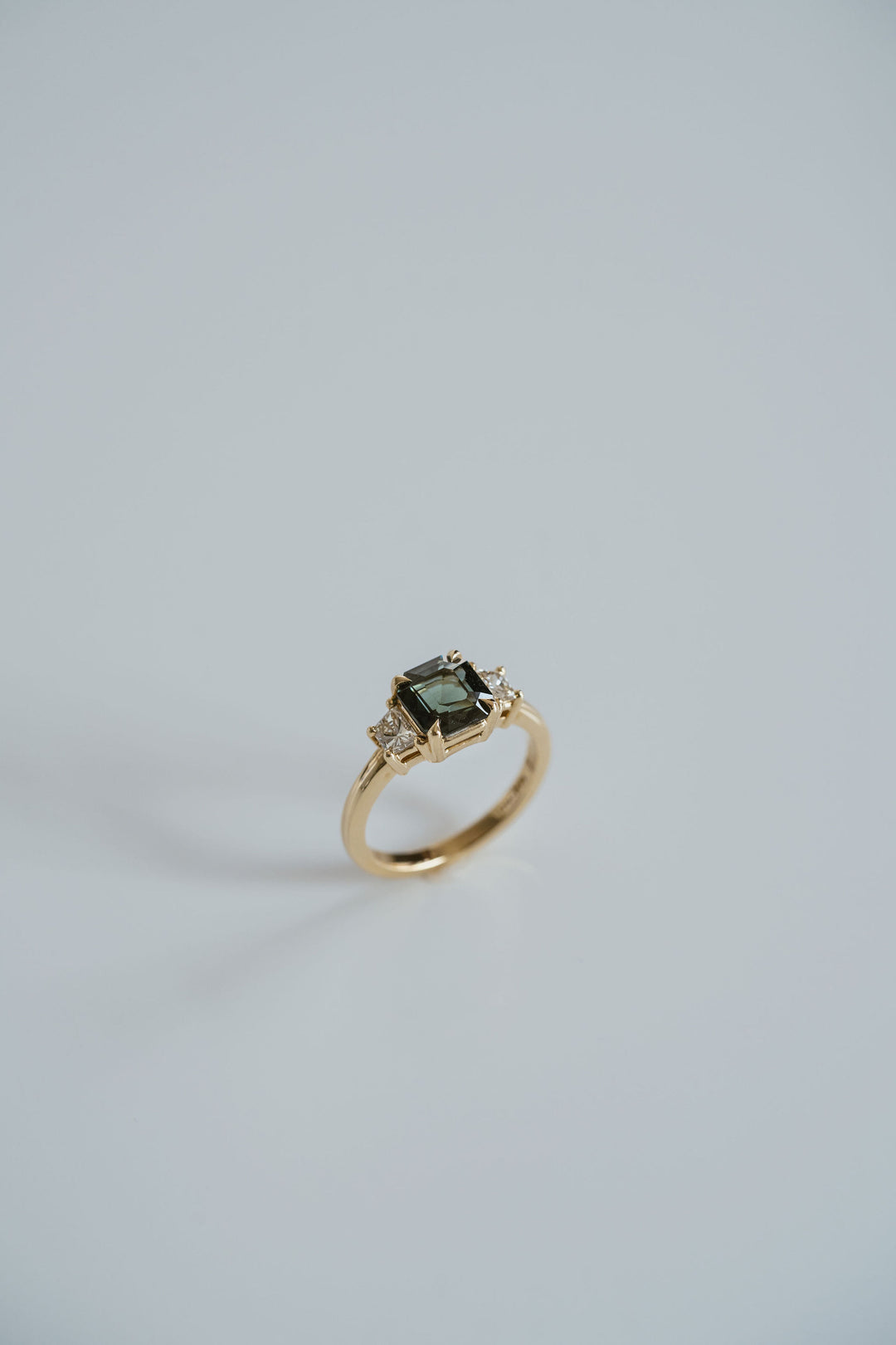 Square Emerald Cut Blue-Green Sapphire with Brilliant Trapezoid Diamond Accents