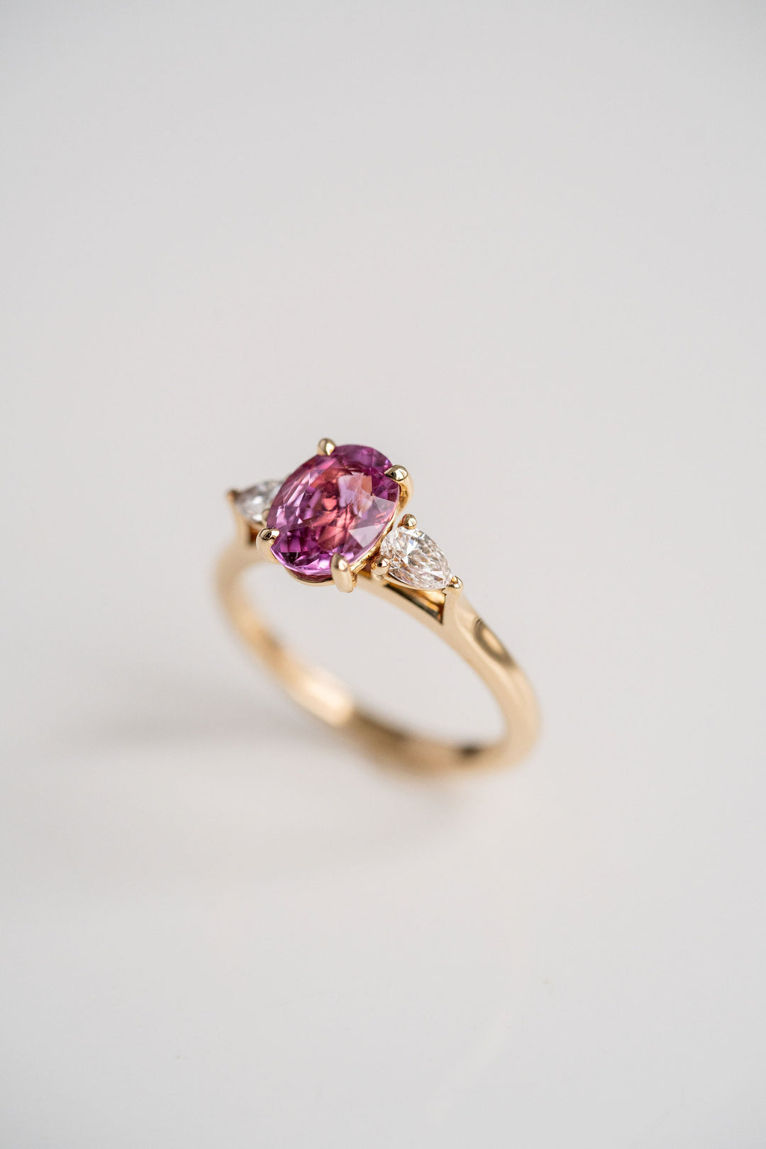 2.18ct. Vivid Pink Oval Sri Lankan Sapphire With Pear Shape Diamond Accents, 14k Yellow Gold