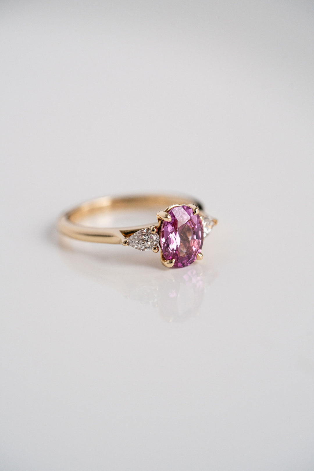 2.18ct. Vivid Pink Oval Sri Lankan Sapphire With Pear Shape Diamond Accents, 14k Yellow Gold