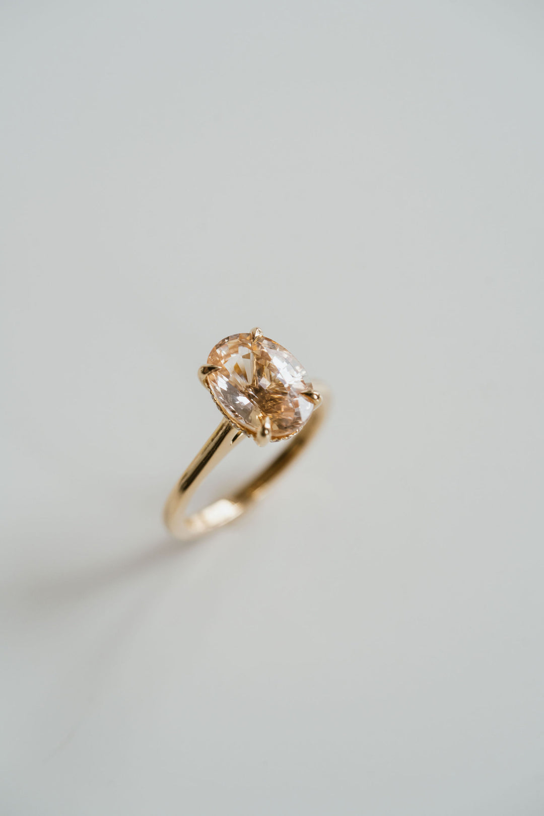 Oval Peach Sapphire Dominion With Diamond Collar