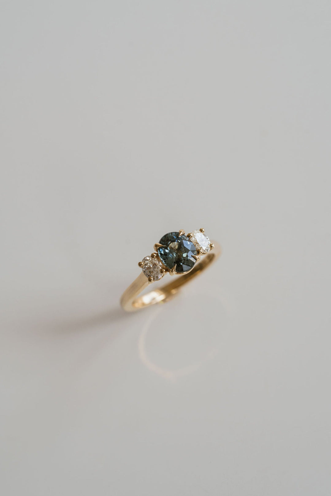 Oval Teal Sapphire With Oval Diamond Accents