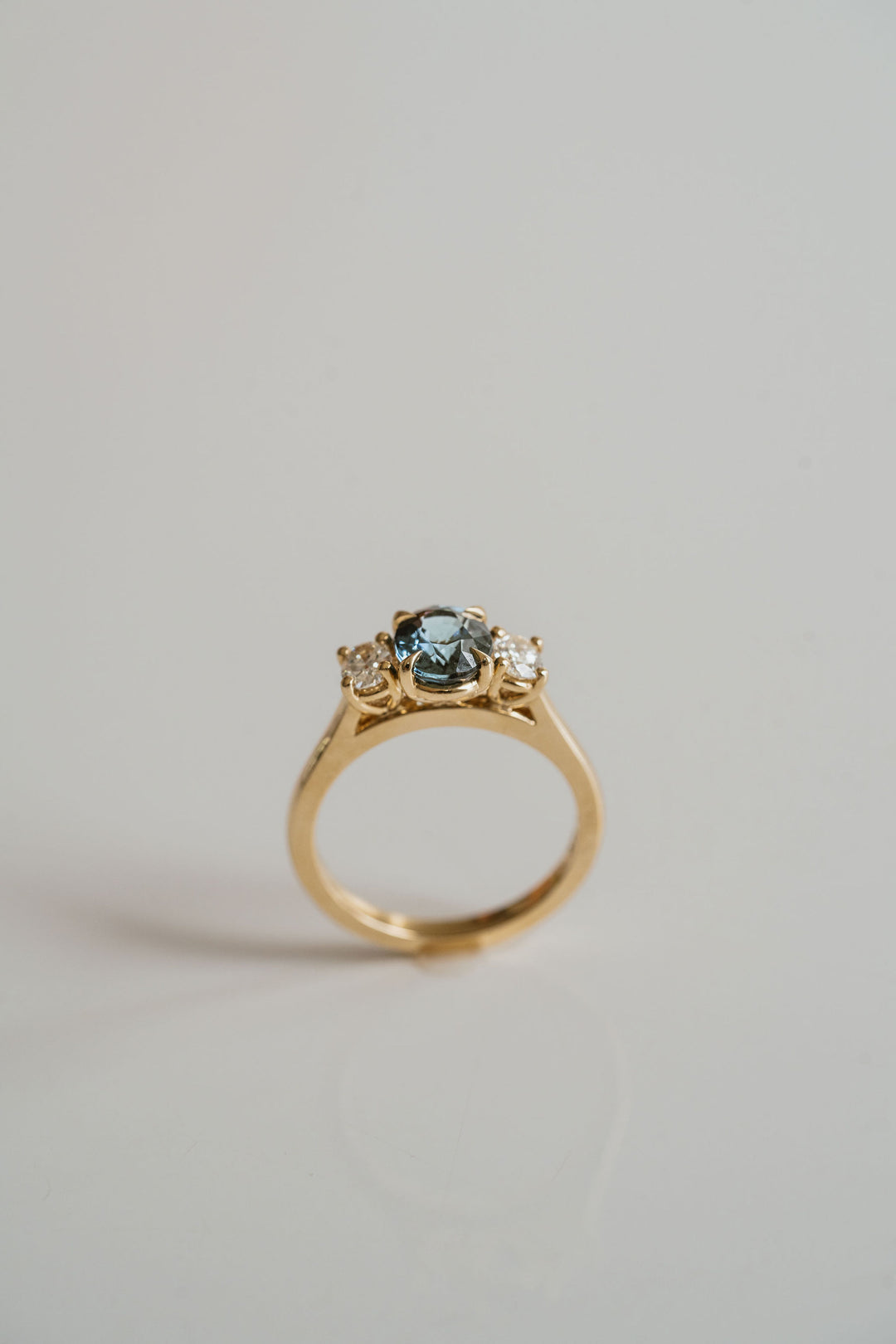 Oval Teal Sapphire With Oval Diamond Accents