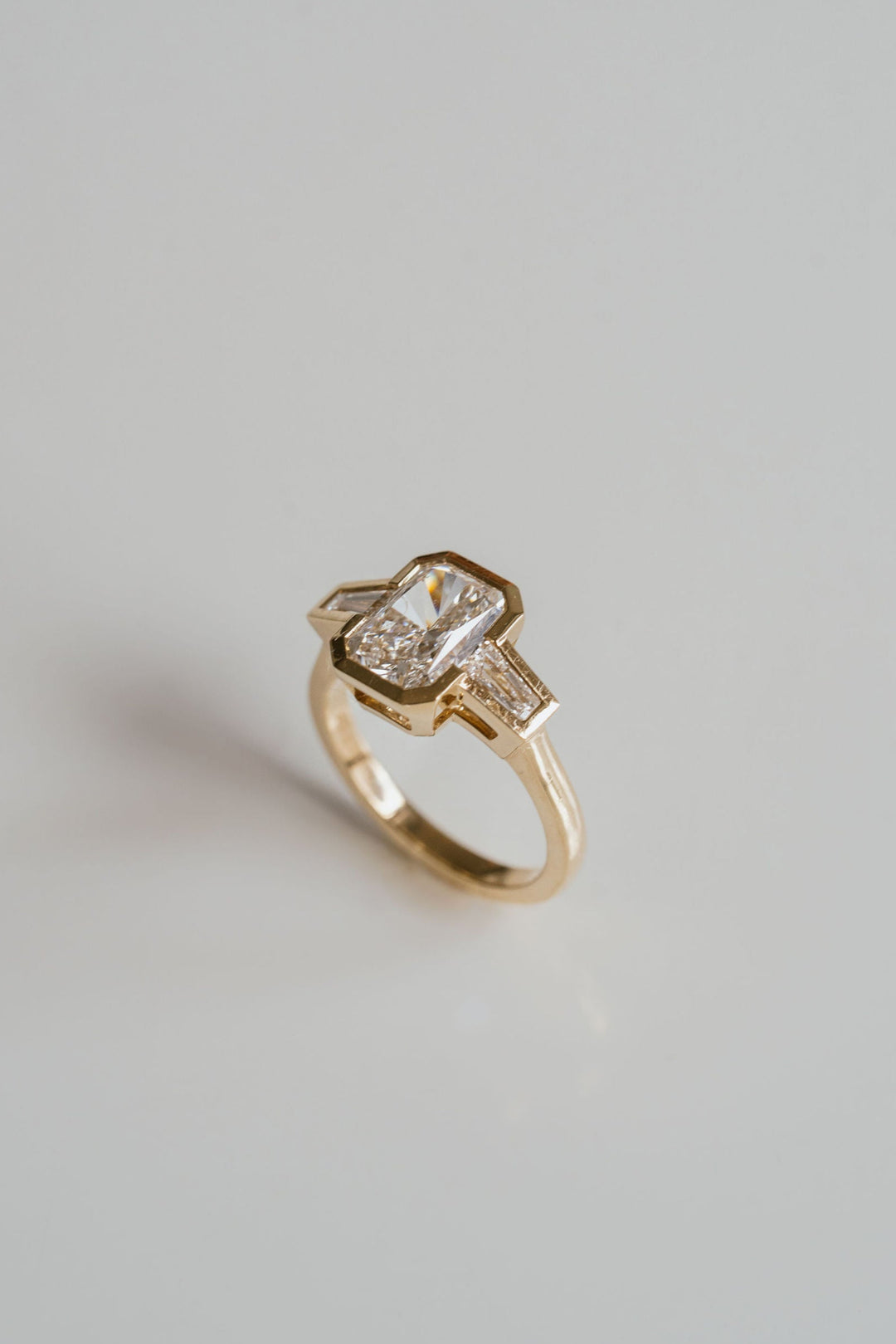 Radiant Cut Diamond Full Bezel With Tapered Baguette Accents
