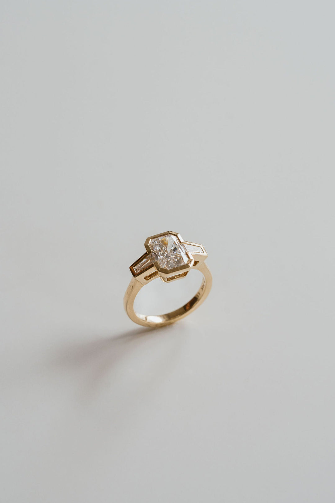 Radiant Cut Diamond Full Bezel With Tapered Baguette Accents