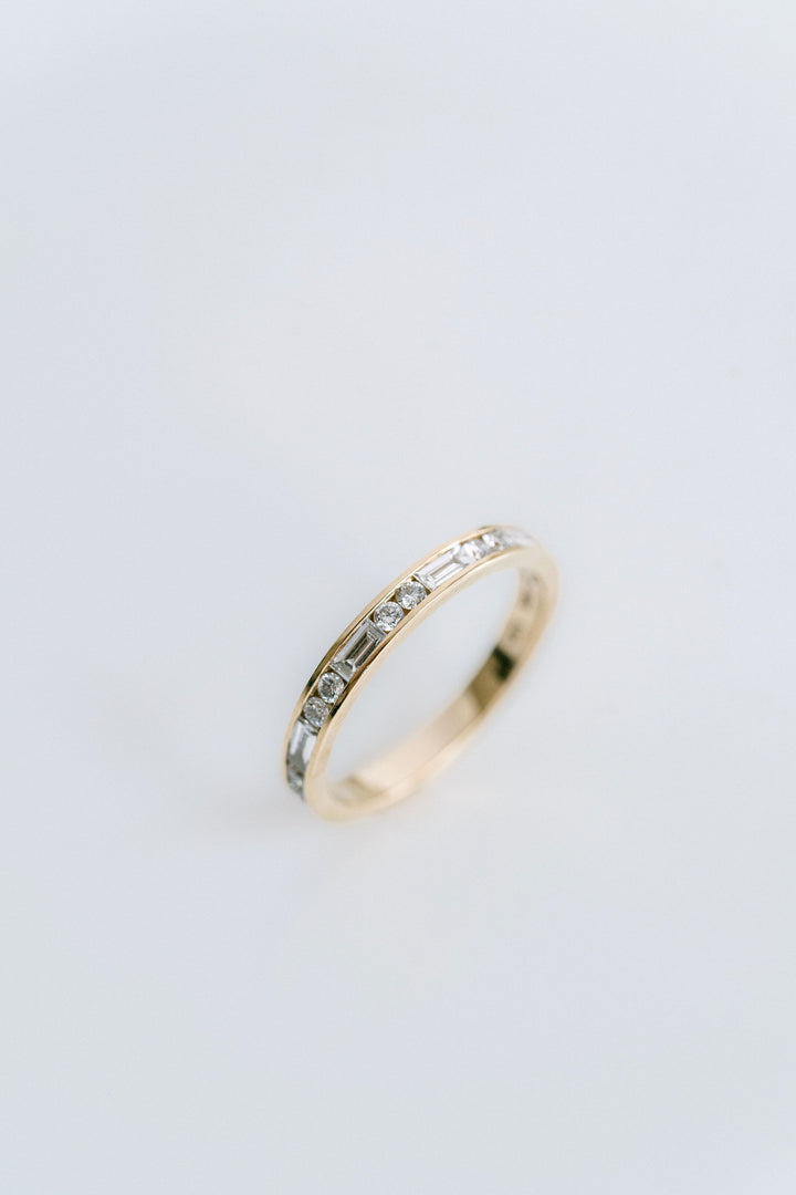 Round Brilliant and Baguette Cut Diamond Alternating Channel Set Band