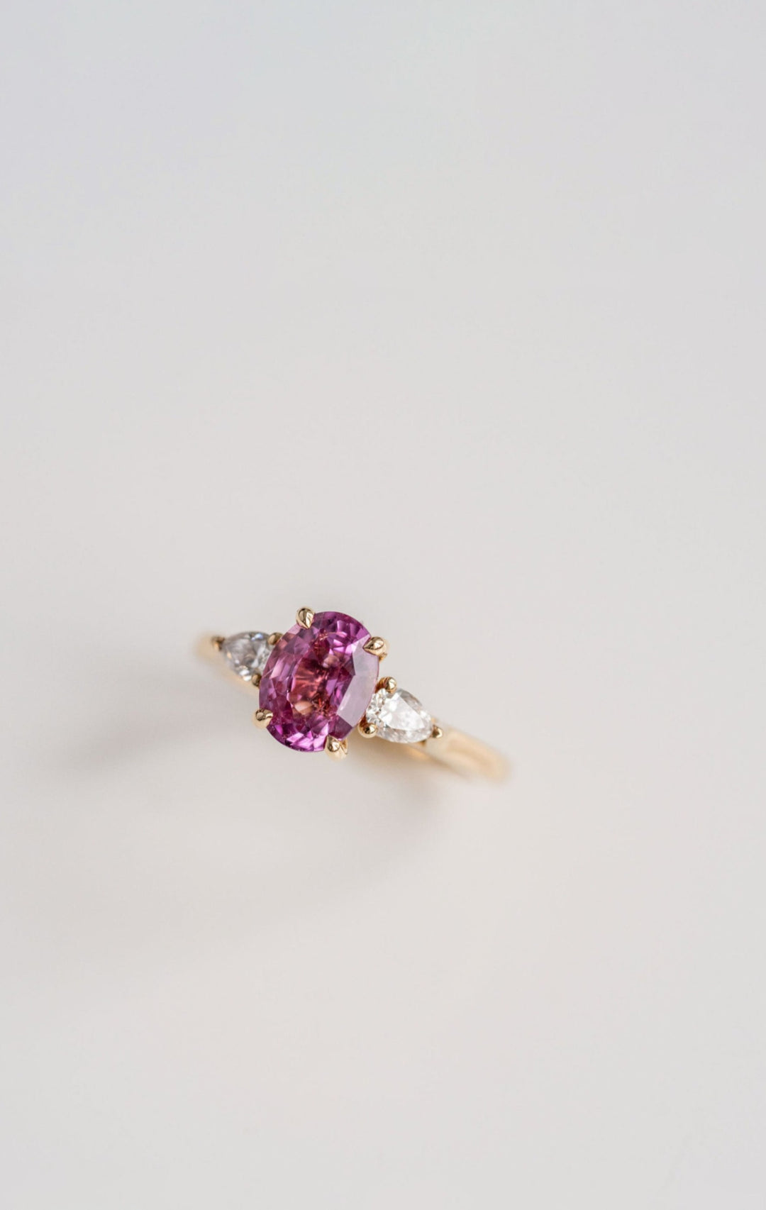 Oval Vivid Pink Sapphire With Pear Shape Diamond Accents
