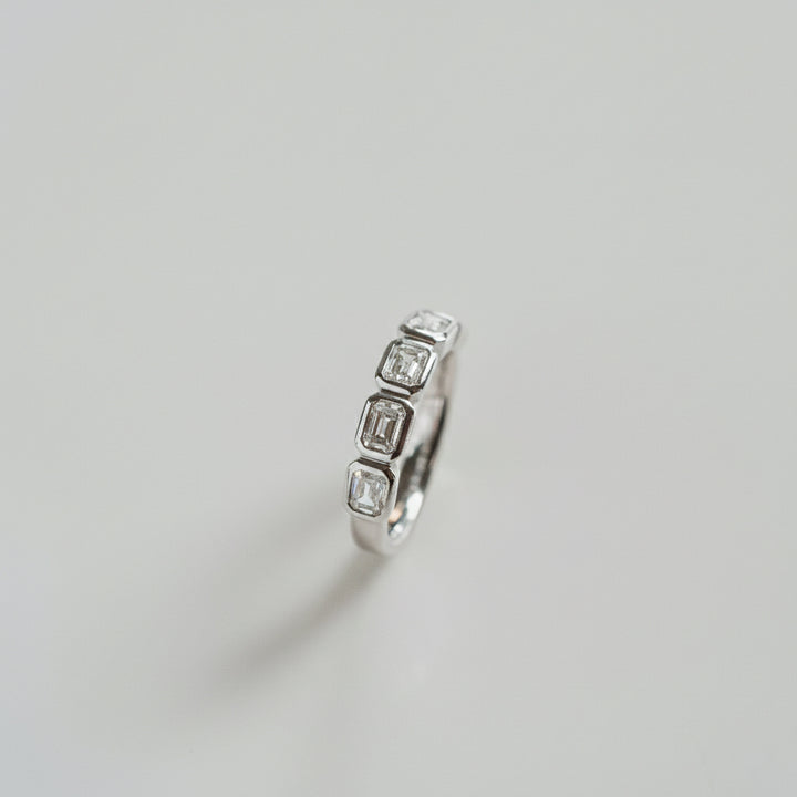 Emerald Cut Diamond East-West Bezel Band