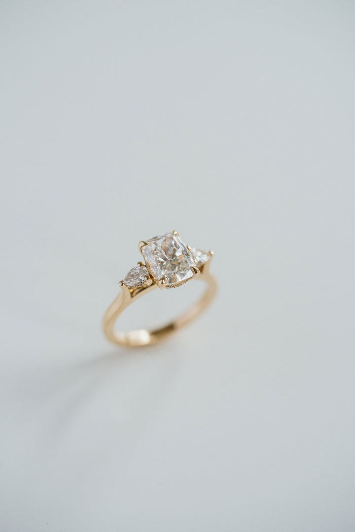 Elongated Cushion Cut Diamond With Pear Accents And Collar