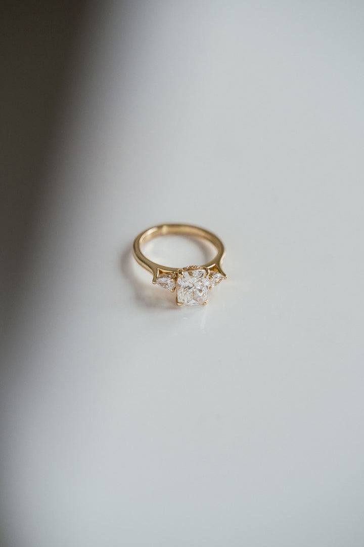 Elongated Cushion Cut Diamond With Pear Accents And Collar