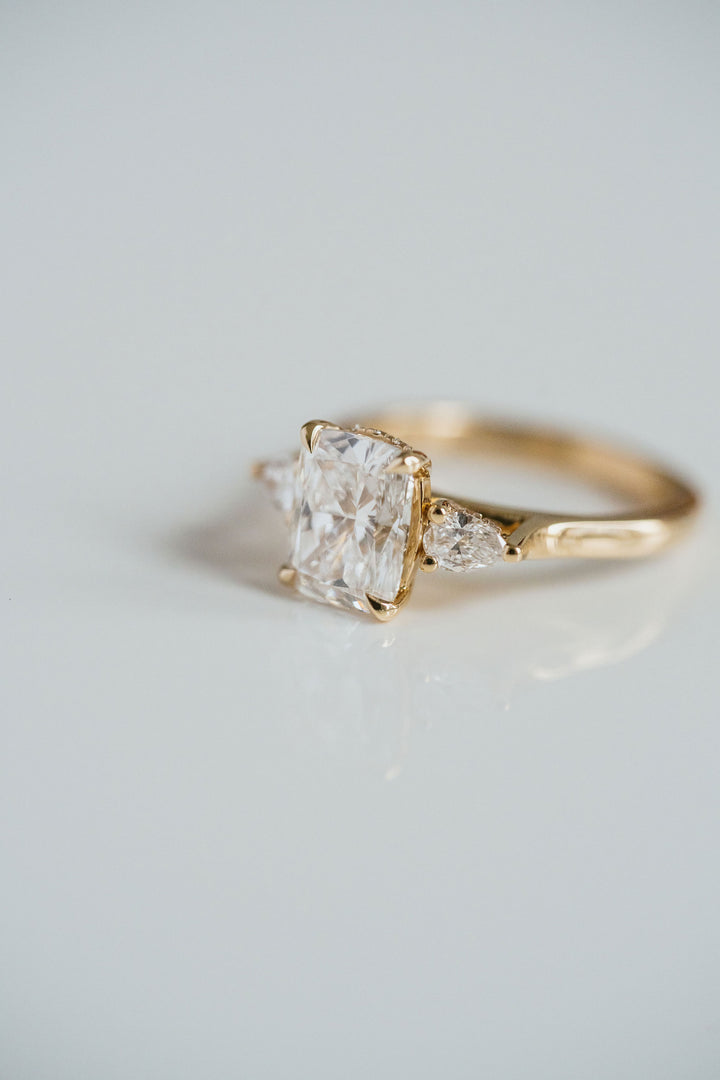 Elongated Cushion Cut Diamond With Pear Accents And Collar