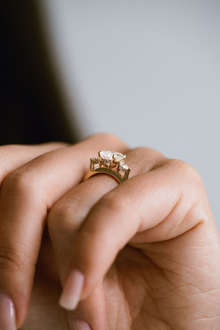 Elongated Cushion Cut Diamond With Pear Accents And Collar