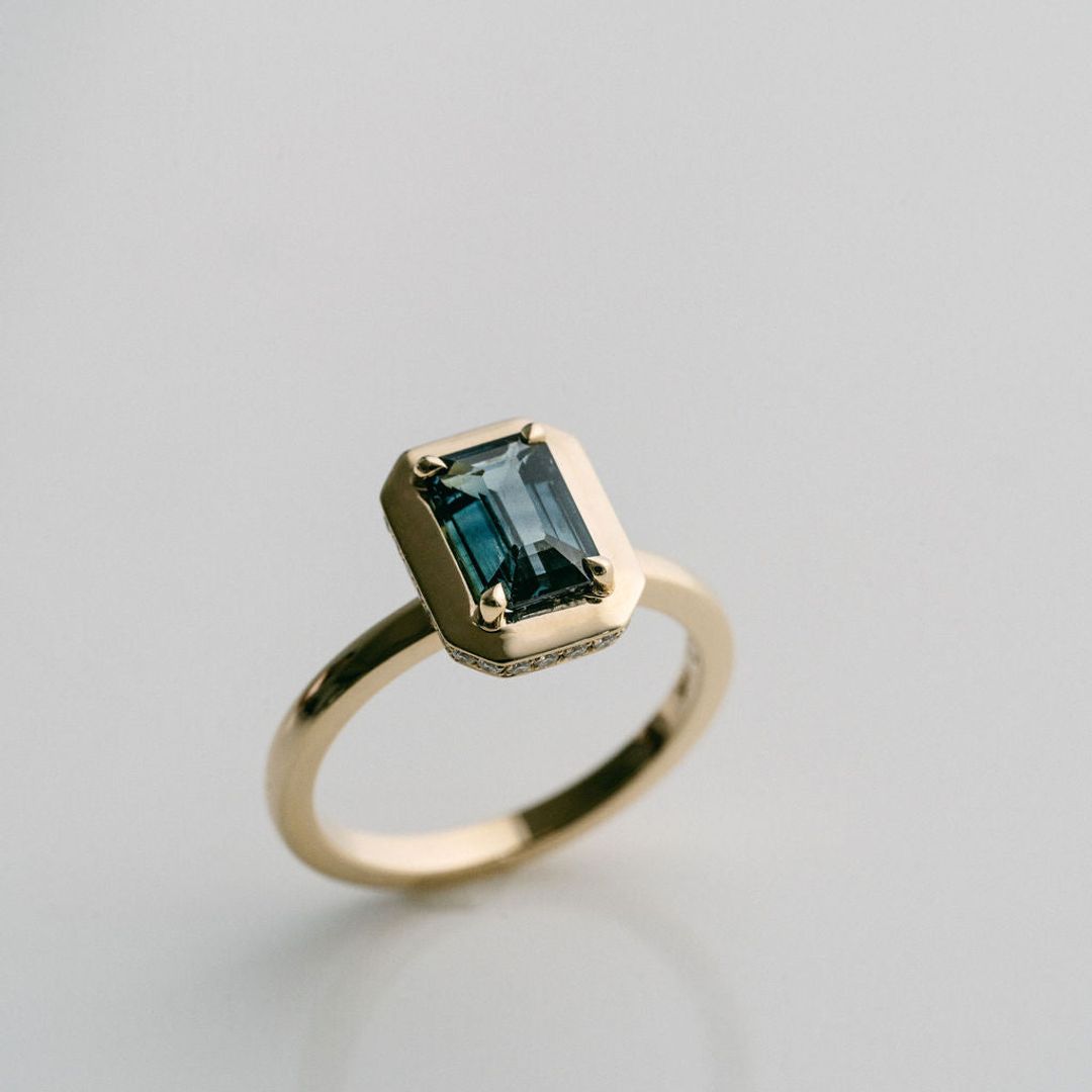 Emerald Cut Blue-Green Sapphire With Solid Gold Halo and Diamond Collar