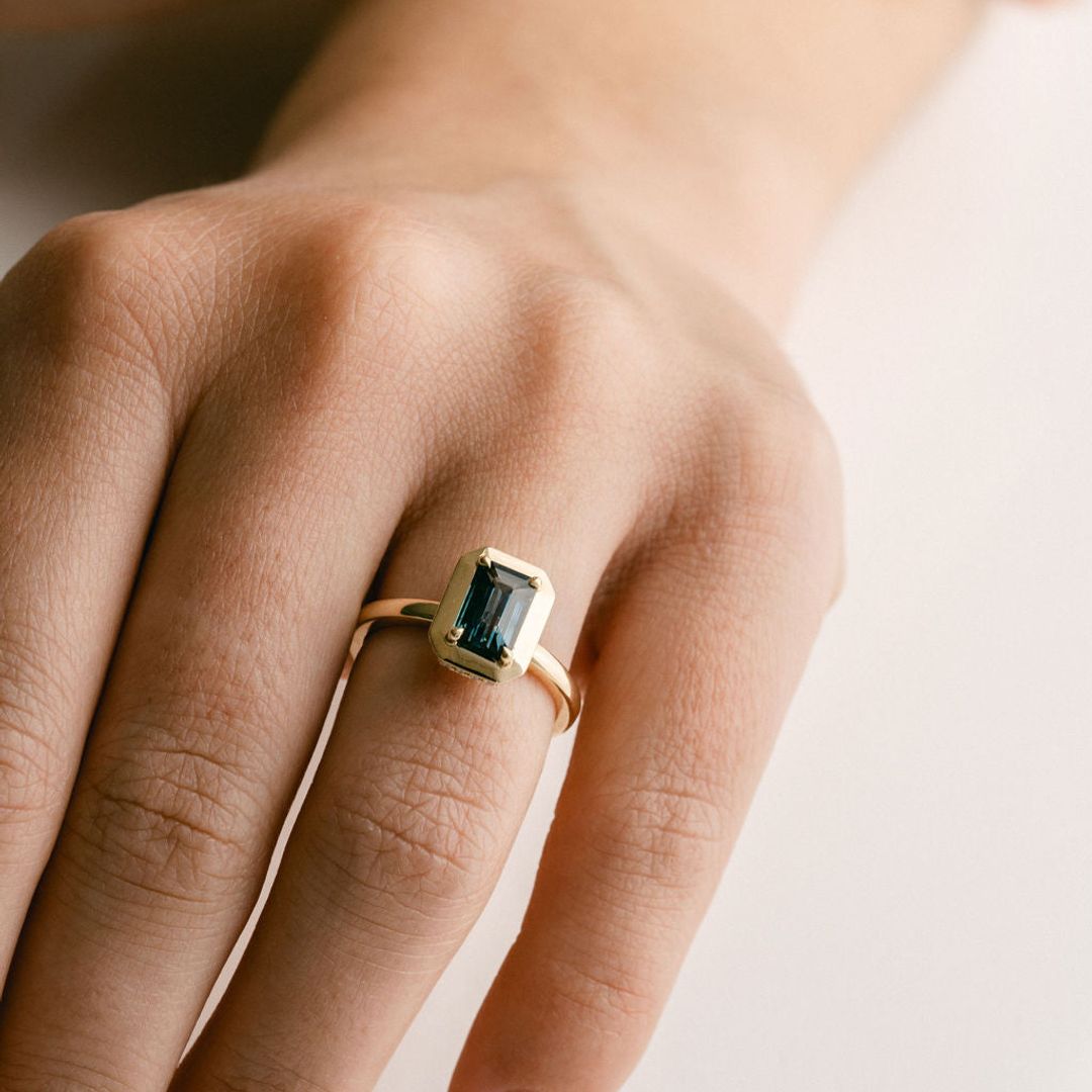 Emerald Cut Blue-Green Sapphire With Solid Gold Halo and Diamond Collar