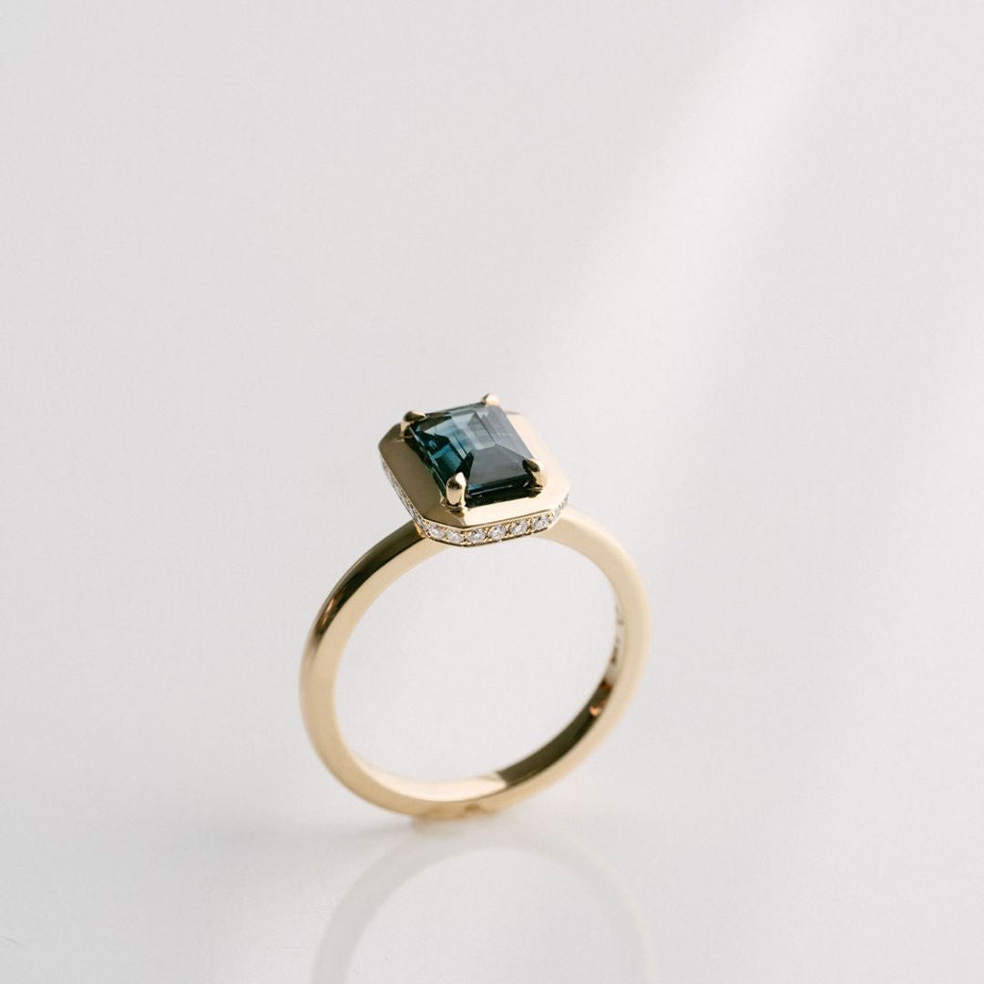 Emerald Cut Blue-Green Sapphire With Solid Gold Halo and Diamond Collar