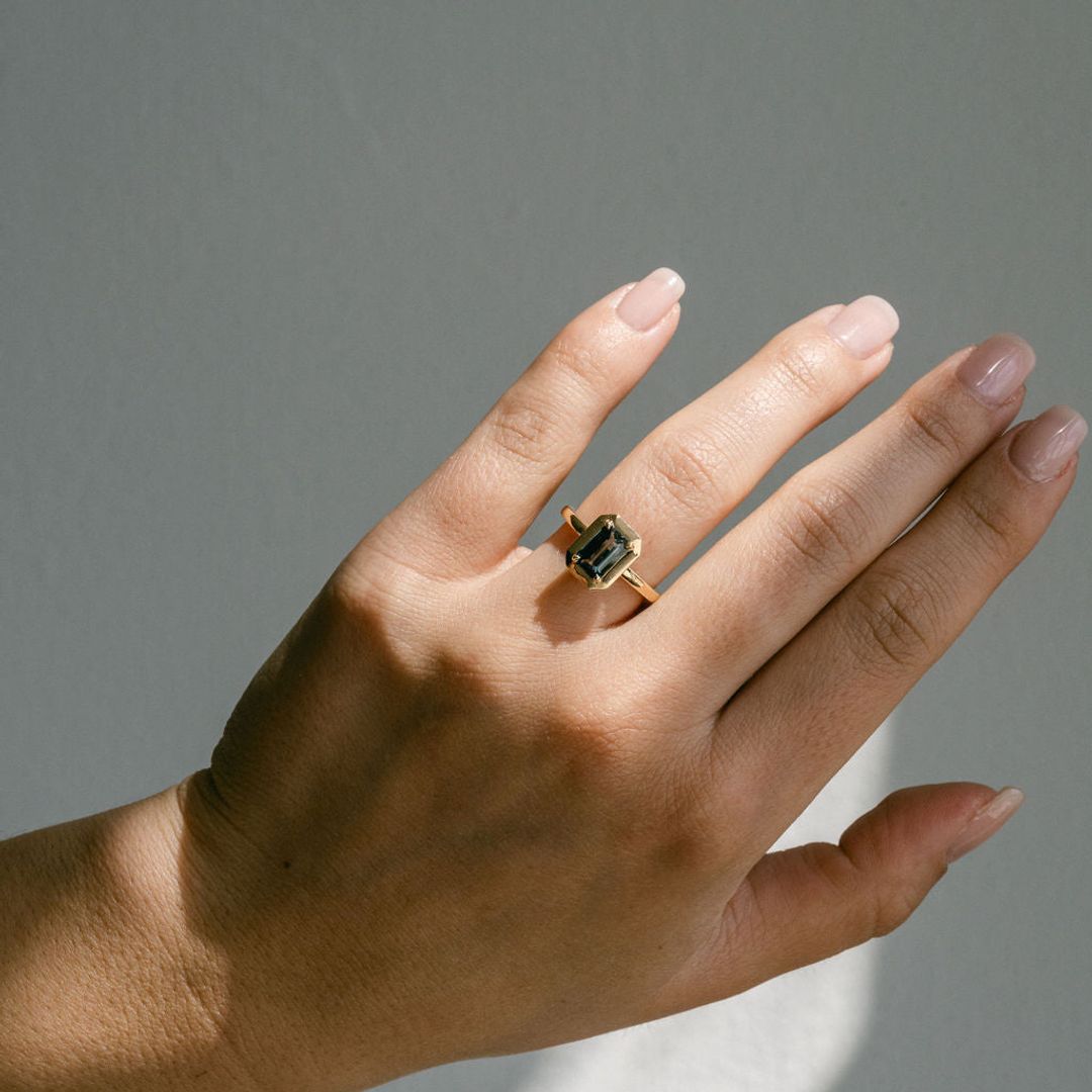 Emerald Cut Blue-Green Sapphire With Solid Gold Halo and Diamond Collar