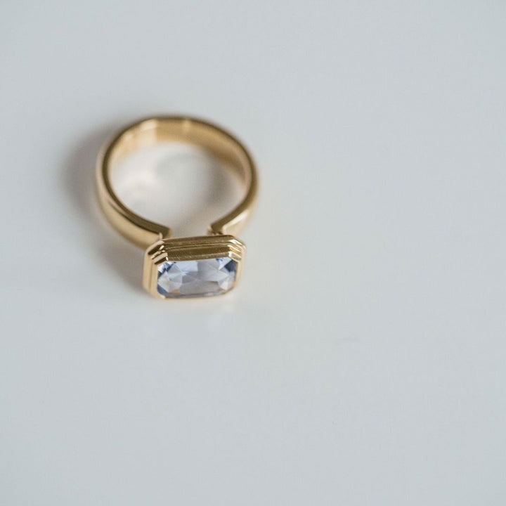 Emerald Cut Blue Sapphire Retro Bezel