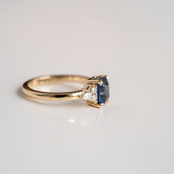 Emerald Cut Blue Sapphire With Diamond Cluster Accents