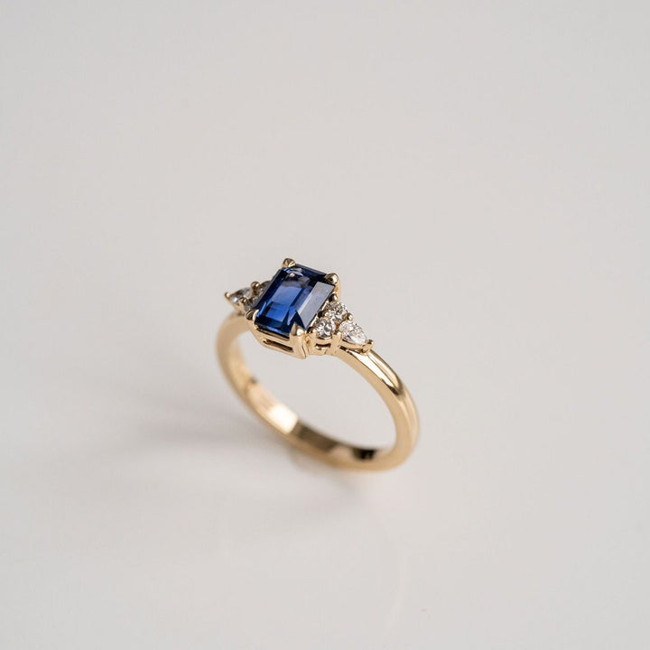 Emerald Cut Blue Sapphire With Diamond Cluster Accents