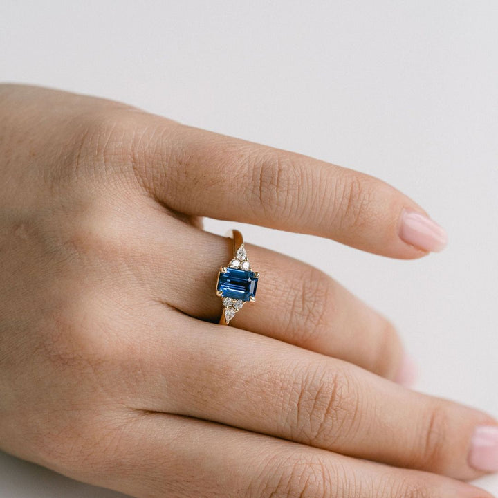 Emerald Cut Blue Sapphire With Diamond Cluster Accents