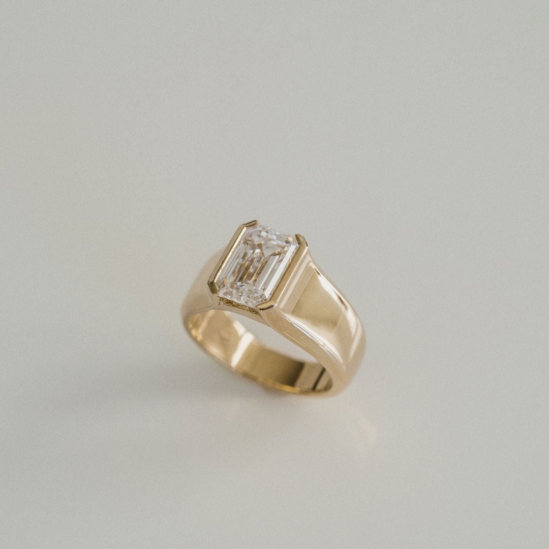 Emerald Cut Diamond Half Bezel Manor Ring