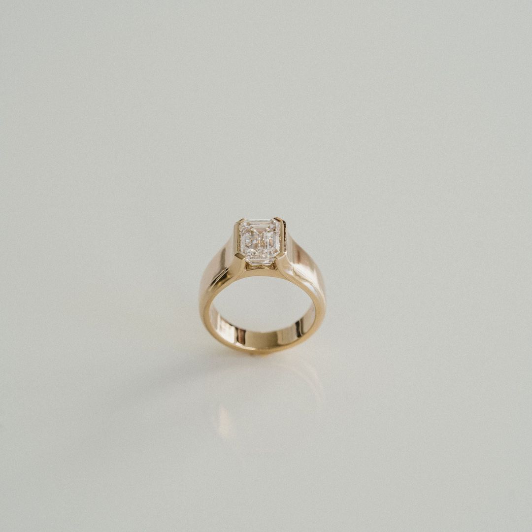 Emerald Cut Diamond Half Bezel Manor Ring