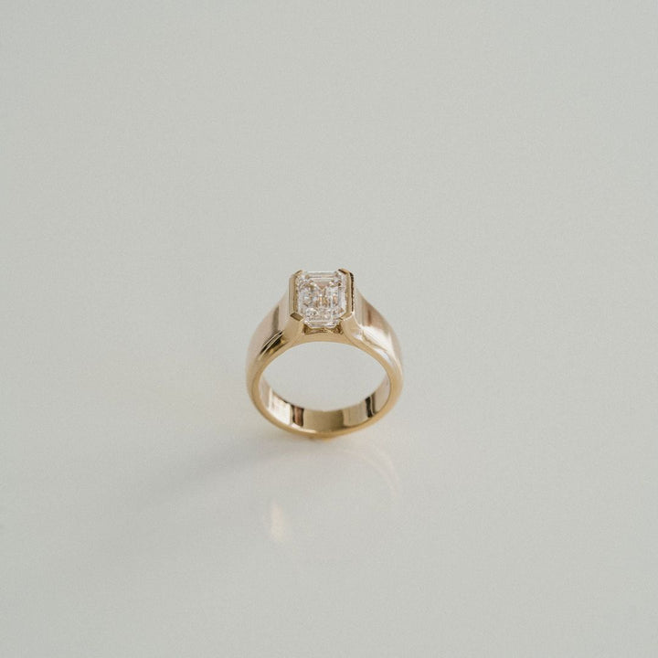 Emerald Cut Diamond Half Bezel Manor Ring