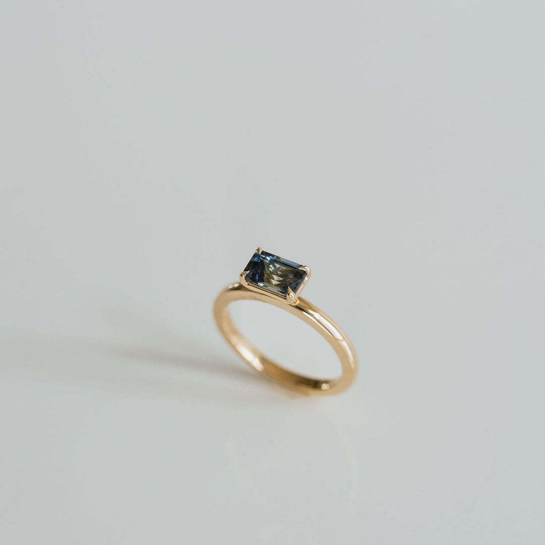 Emerald Cut East-West Blue Green Sapphire Solitaire
