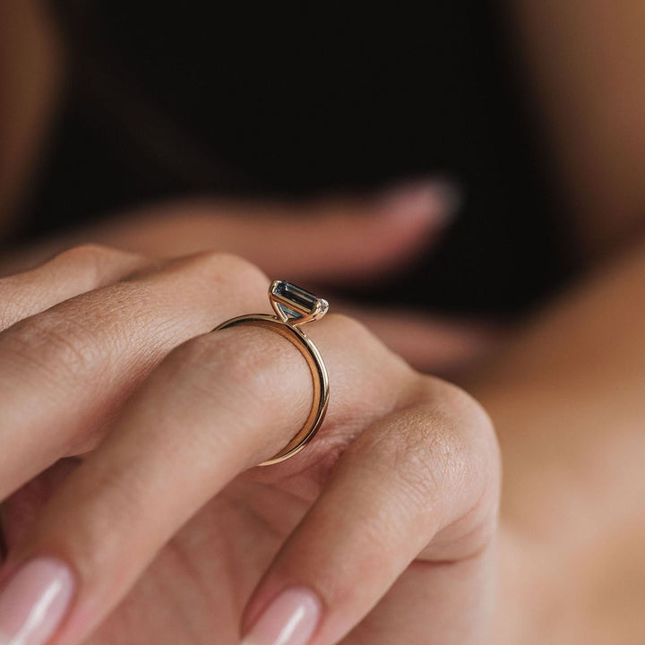 Emerald Cut East-West Blue Green Sapphire Solitaire