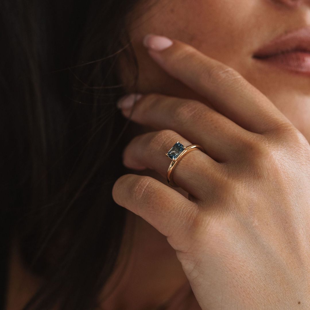 Emerald Cut East-West Blue Green Sapphire Solitaire