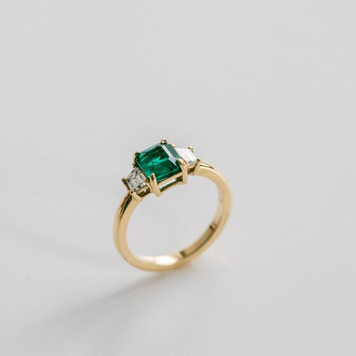 Emerald Cut Emerald With Trapezoid Diamond Accents