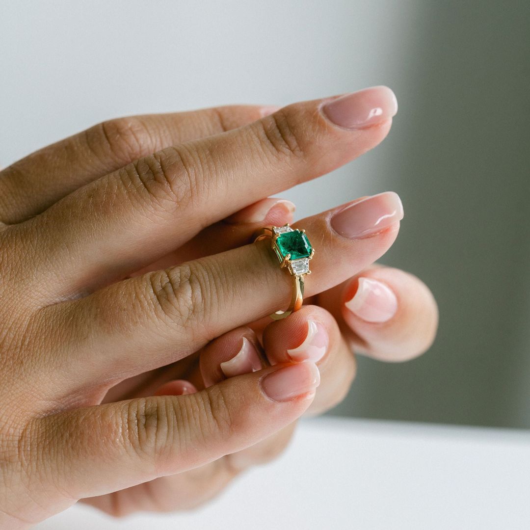 Emerald Cut Emerald With Trapezoid Diamond Accents