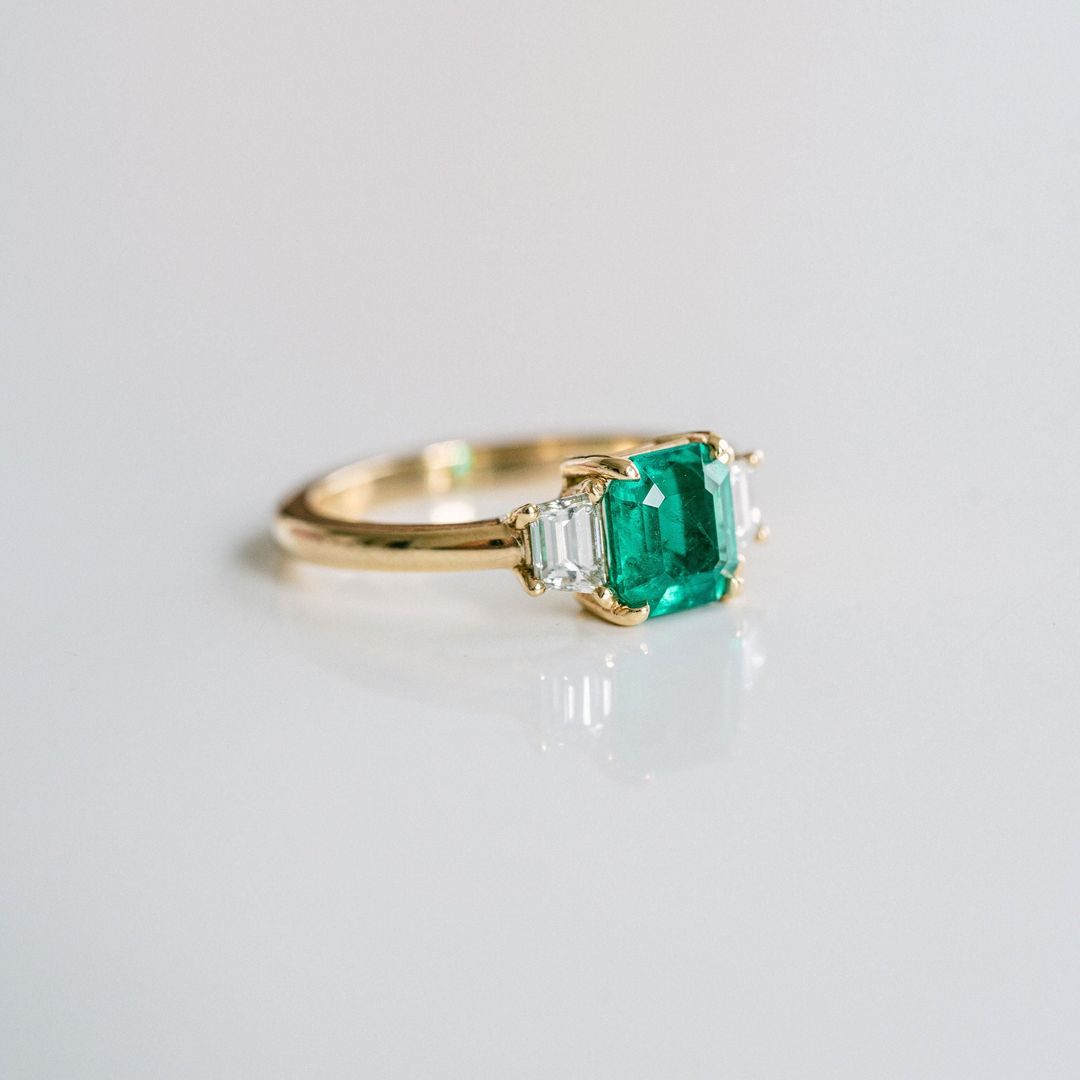 Emerald Cut Emerald With Trapezoid Diamond Accents