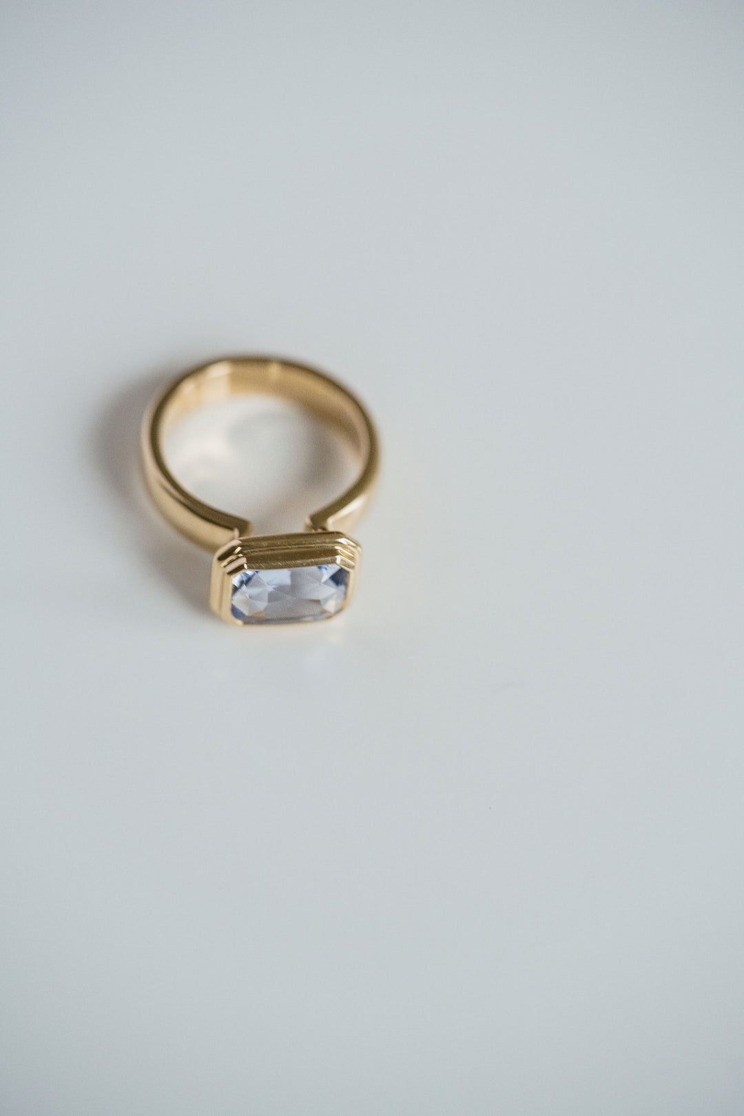 Emerald Cut Blue Sapphire Retro Bezel