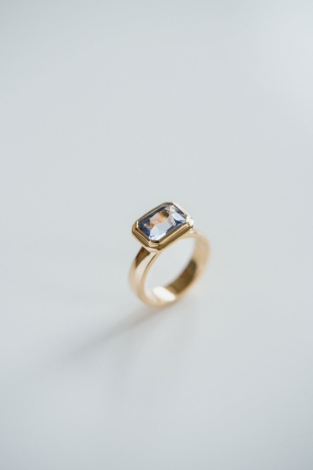 Emerald Cut Blue Sapphire Retro Bezel