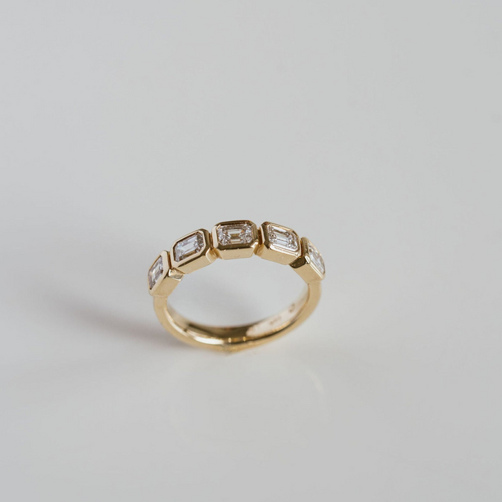 Emerald Cut Diamond East-West Bezel Band