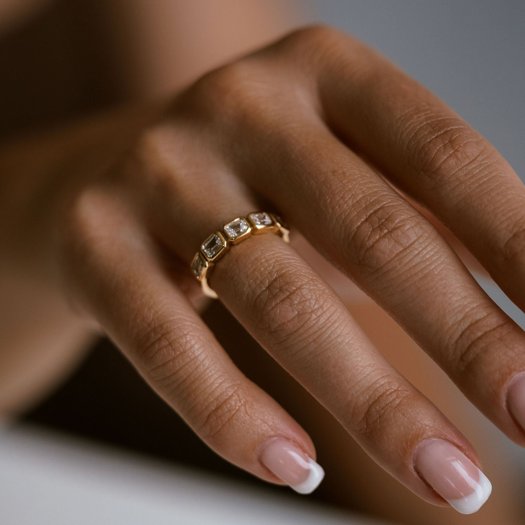 Emerald Cut Diamond East-West Bezel Band