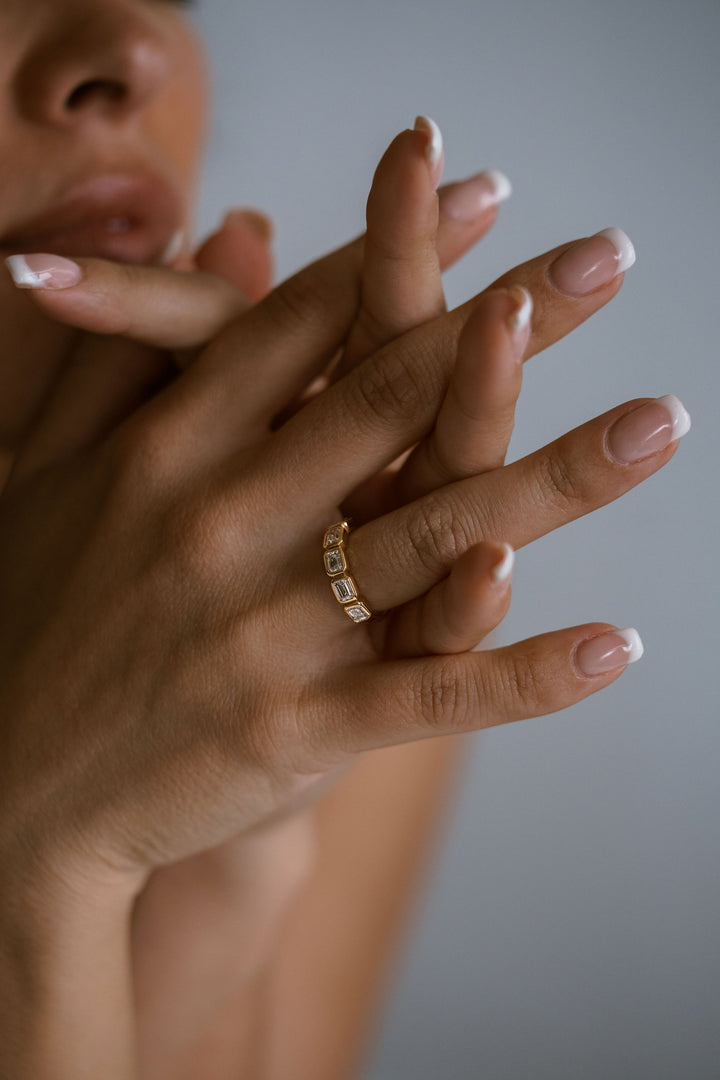 Emerald Cut Diamond East-West Bezel Band